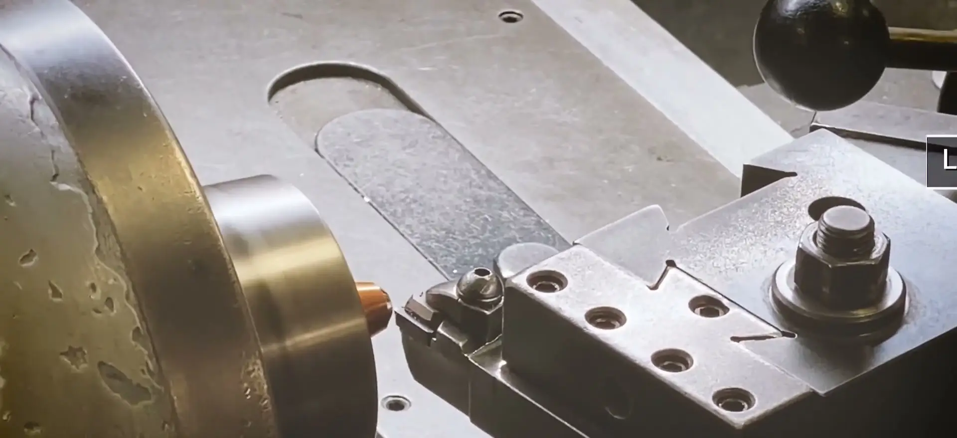 Lathe turning a cylindrical steel part